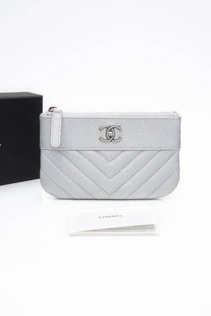 CHANEL Metallic Silver Caviar Chevron Quilted Small Mademoiselle Zip Pouch Case