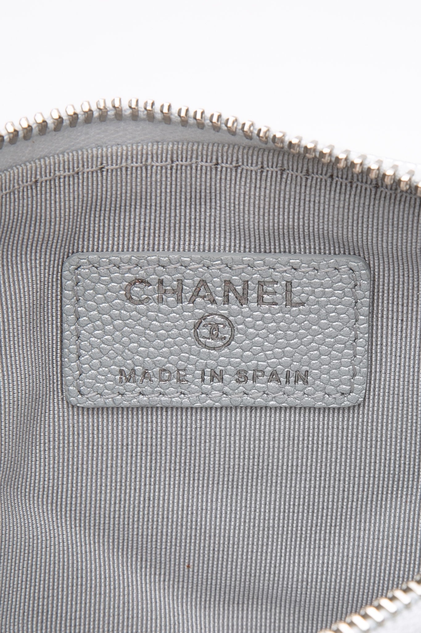 CHANEL Metallic Silver Caviar Chevron Quilted Small Mademoiselle Zip Pouch Case