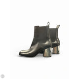 Boots Luxury Designer By Gucci In Black & Silver, Size: 9