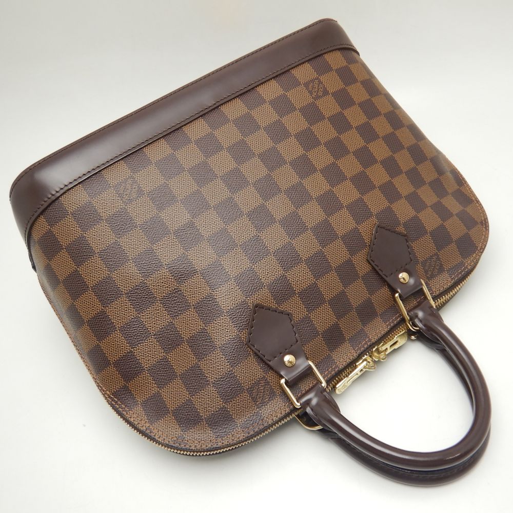 Louis Vuitton Damier Alma Handbag Ebene