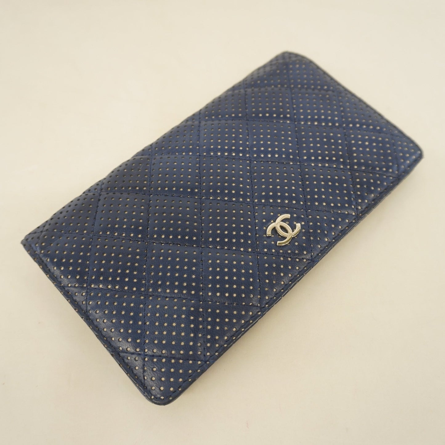 Chanel bi-fold long wallet matelasse lambskin navy silver metal