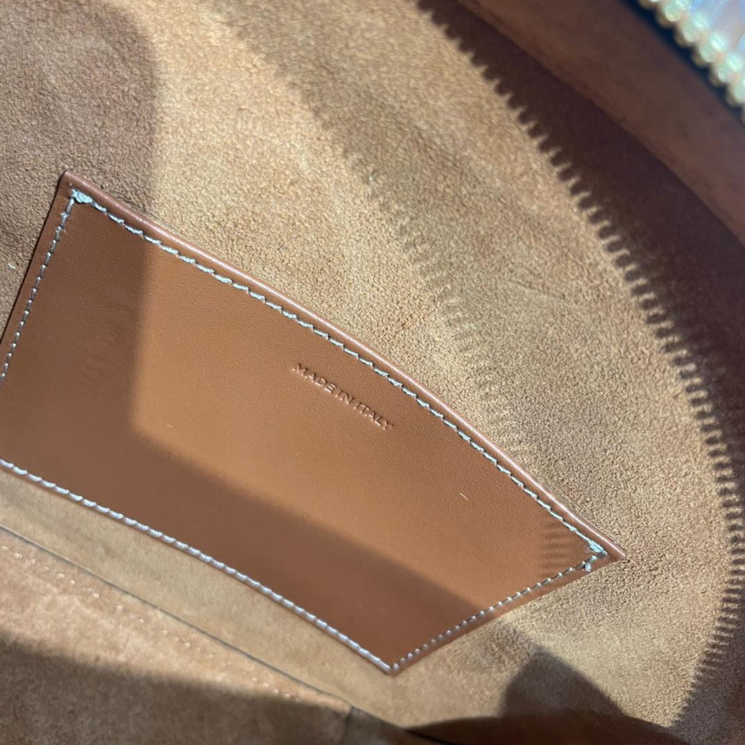 TRIOMPHE TOP HANDLE BAG 20 IN BRONZE BROWN CALFSKIN Amelia