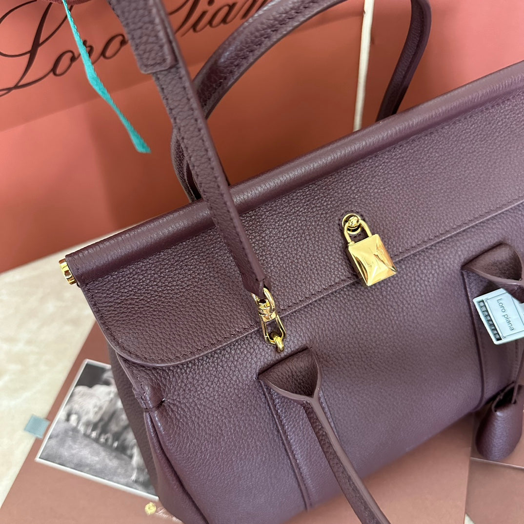 LOOM BAG 25 IN WINE PURPLE CALFSKIN WITH GOLD HARDWARE by Amelia
