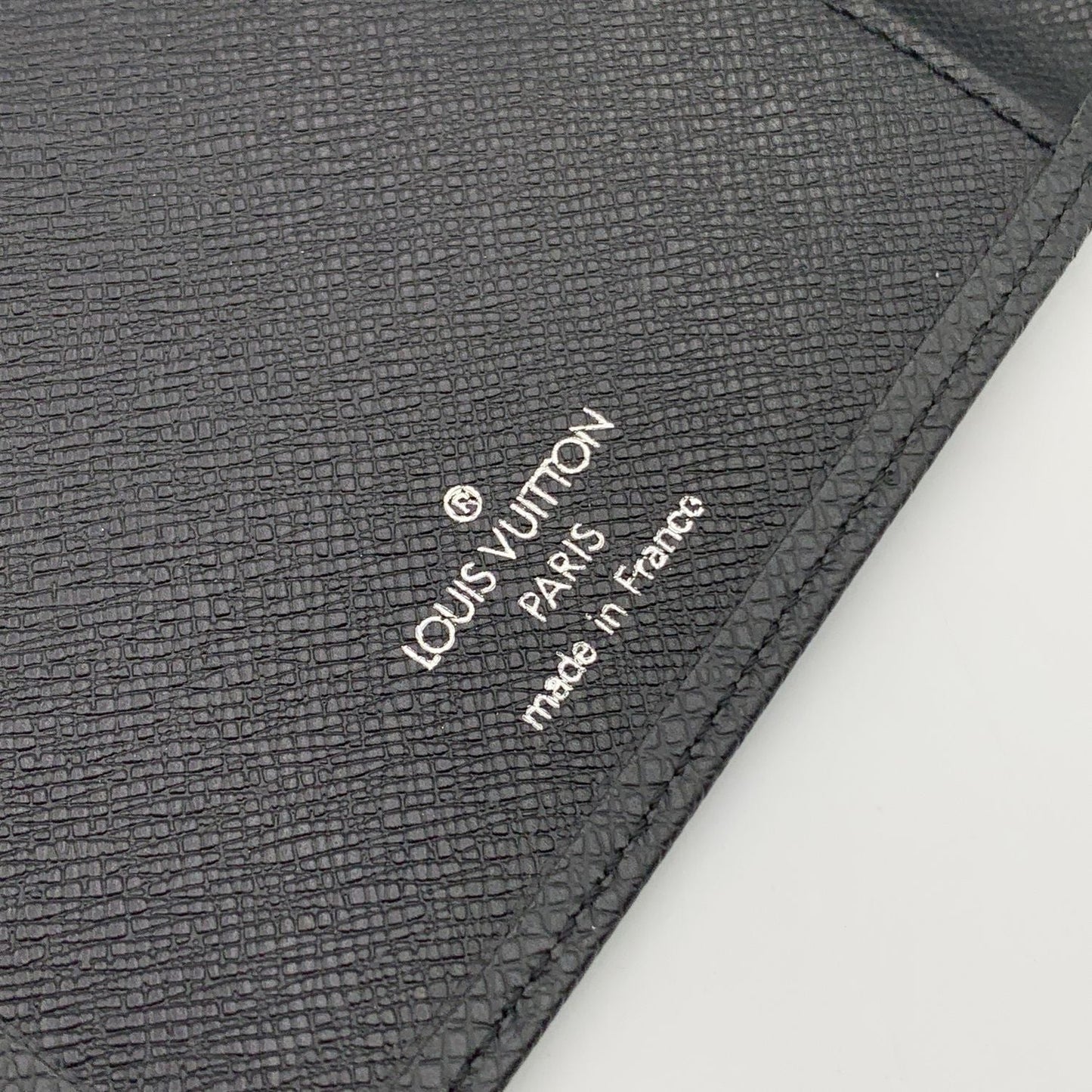 LOUIS VUITTON   Black Taiga Leather Vertical Bifold Long Wallet