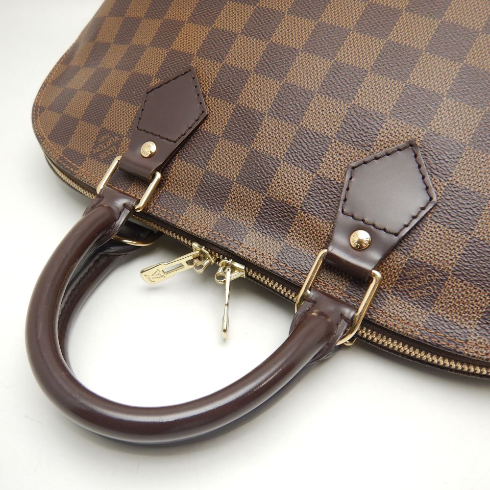 Louis Vuitton Damier Alma Handbag Ebene