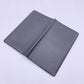 LOUIS VUITTON   Black Taiga Leather Vertical Bifold Long Wallet