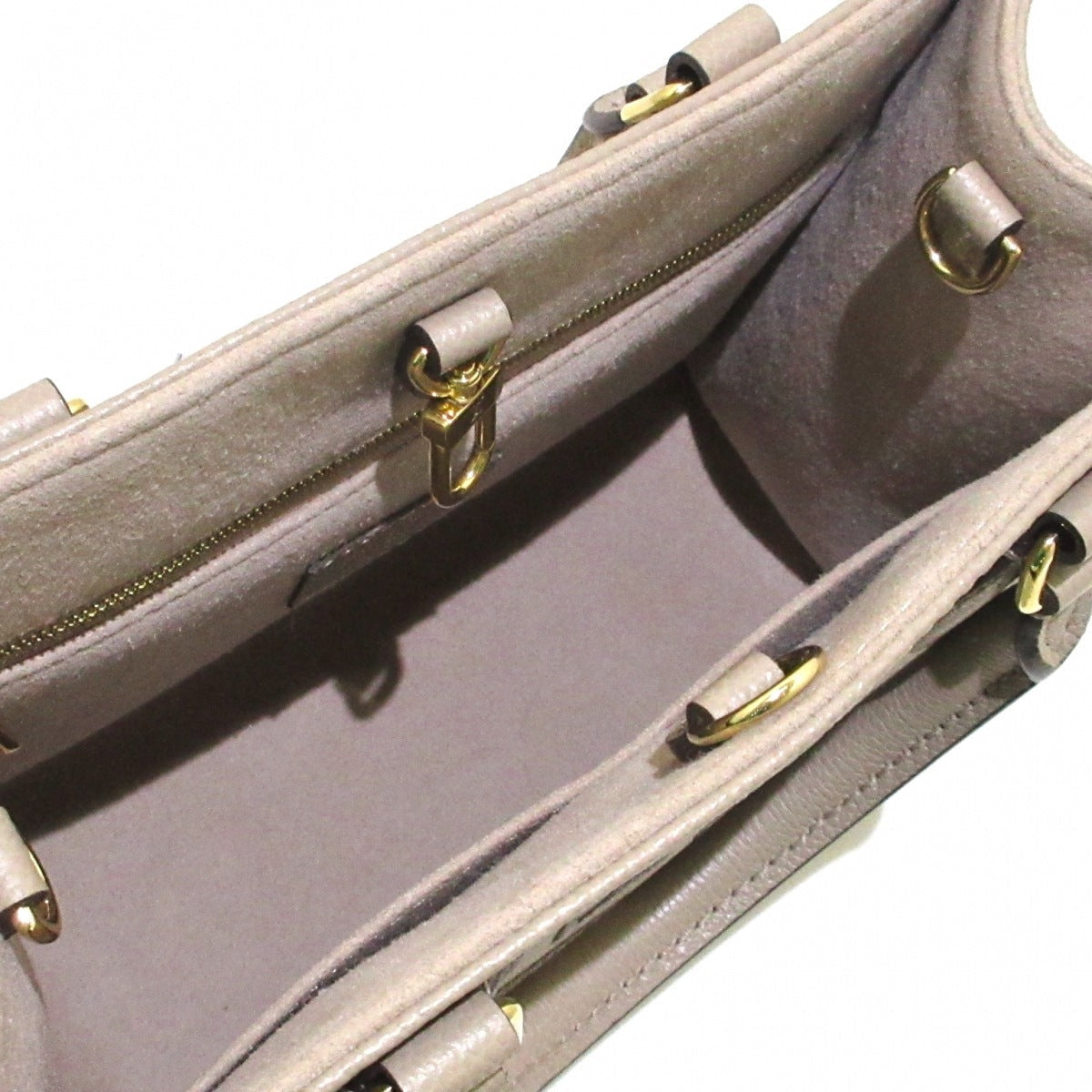 Louis Vuitton On The Go PM Handbag Tourtrail Creme Embossed