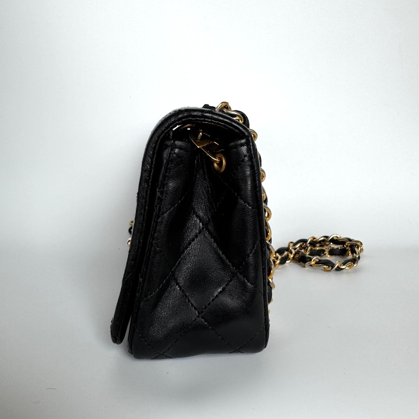 Chanel Classic Flap Mini   1989-1991 Black Lambskin Leather with 24k Gold Hardware