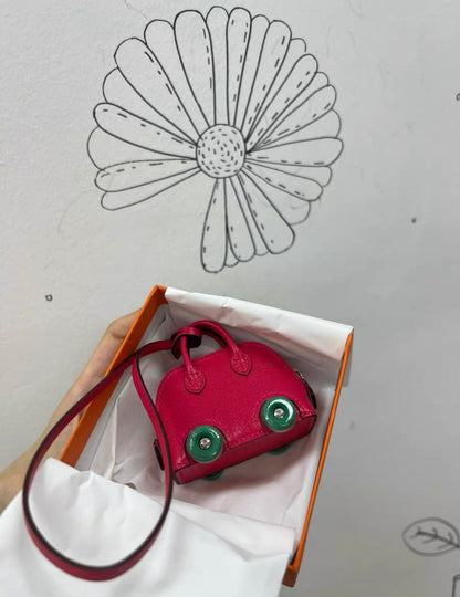 Hermes Bolide on Wheels Charm?Rose extreme/Vert vertigo Chevre chamkila goatskin Silver hardware