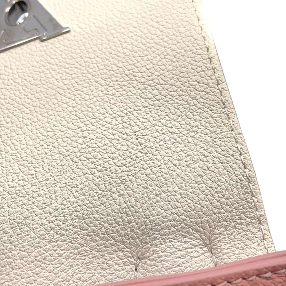 Louis Vuitton Lock Me Mini Leather Silver Hardware Backpack