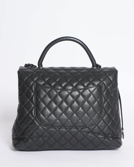 Chanel Quilted Caviar Coco Handle Bag in Black