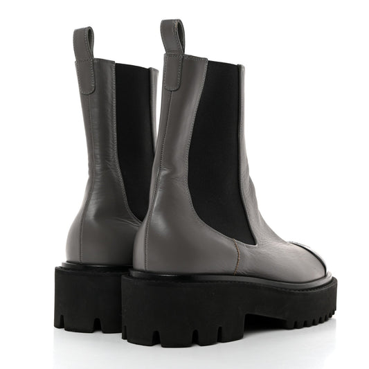CHANEL CC CRUMPLED CALFSKIN PATENT CAP TOE CHELSEA BOOTS