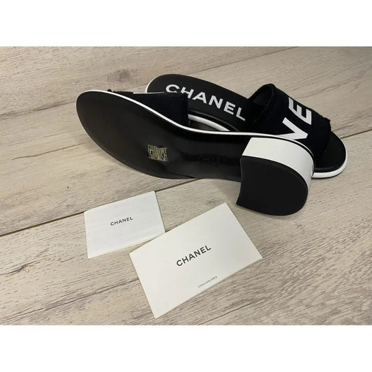 CHANEL LAMBSKIN CHA-NEL SANDLAS MULES