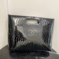 CHANEL CC PERFORATED PATENT CLUTCH BAG