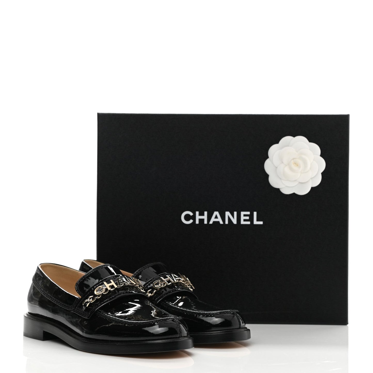 CHANEL SHINY PATENT CALFSKIN LOGO LOAFERS