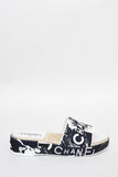 CHANEL COCO SIGNATURE PRINTED PLATFORM MULE SLIDES