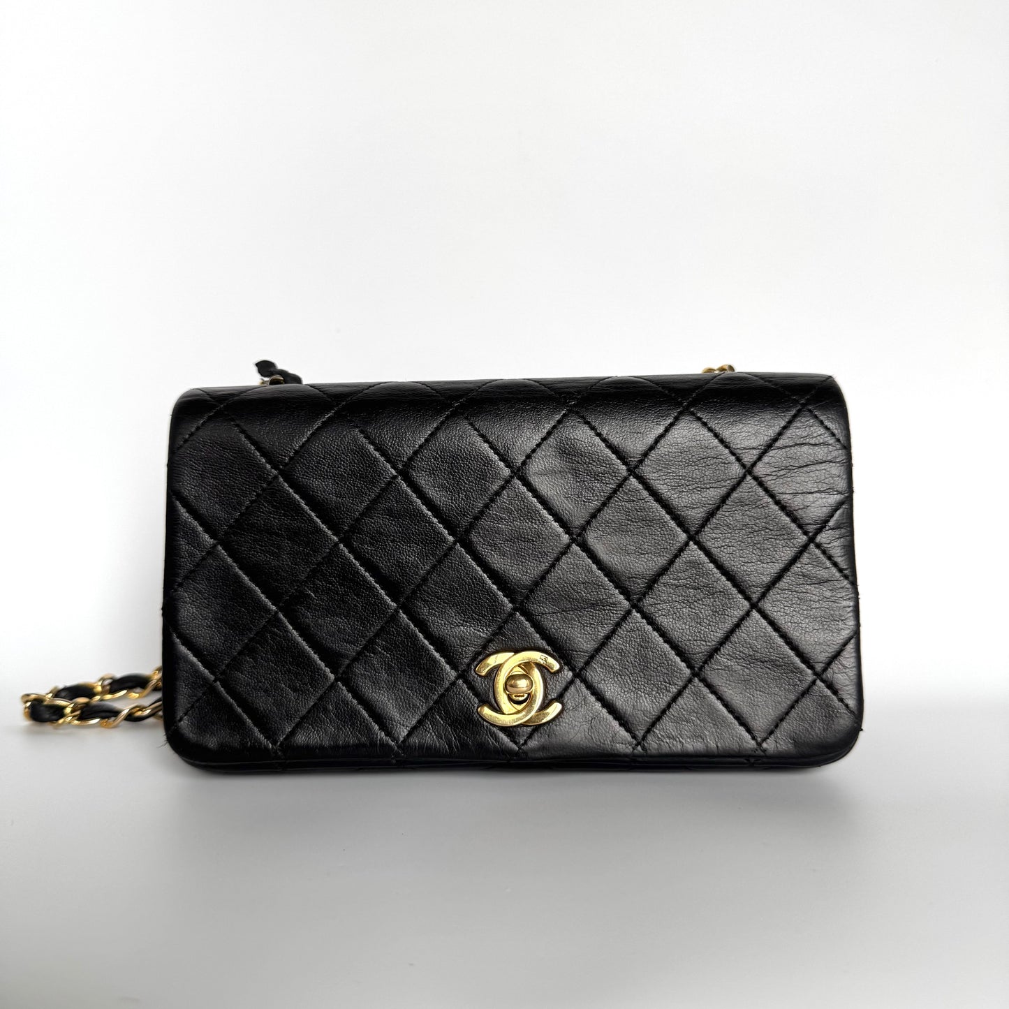 Chanel Classic Flap Mini   1989-1991 Black Lambskin Leather with 24k Gold Hardware