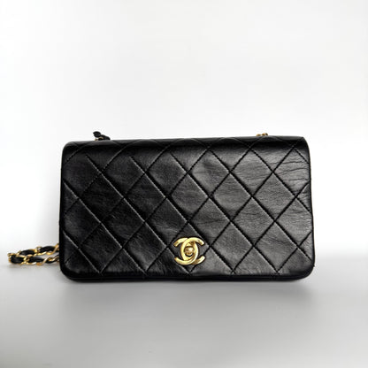 Chanel Classic Flap Mini   1989-1991 Black Lambskin Leather with 24k Gold Hardware