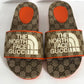 GUCCI X NORTH FACE MONOGRAM SLIDES