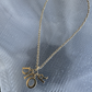 Dior   Gold Tone Beige Enamel Logo Charm Necklace