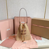 WANDER BUCKET BAG 23 IN NATURAL RAFFIA WITH LEATHER TRIM Amelia