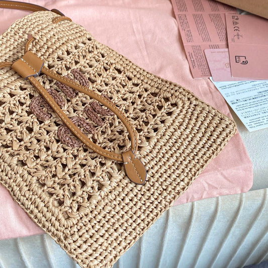 WANDER BUCKET BAG 23 IN NATURAL RAFFIA WITH LEATHER TRIM Amelia