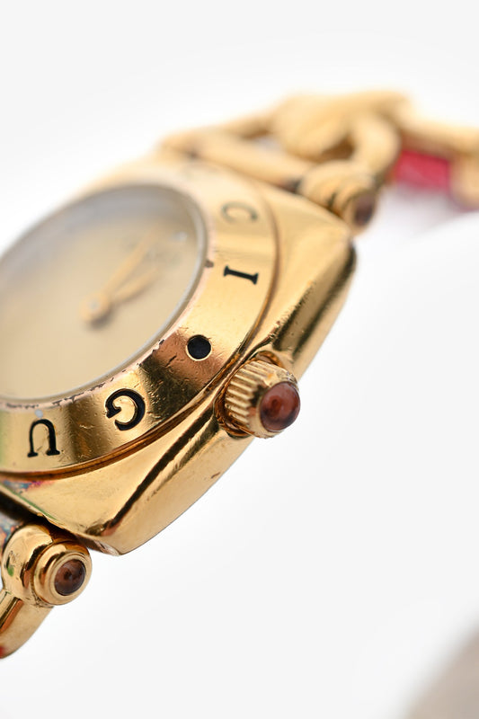 Gucci   Gold Tone Metal/Pink Lizard Embossed Strap Watch
