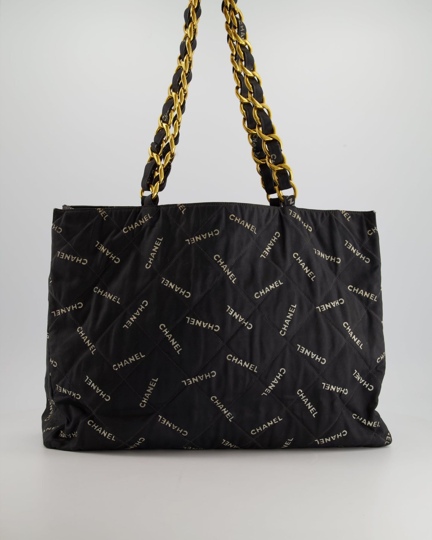 Chanel   Black Bag in Quilted Canvas Logo Print with Gold Hardware