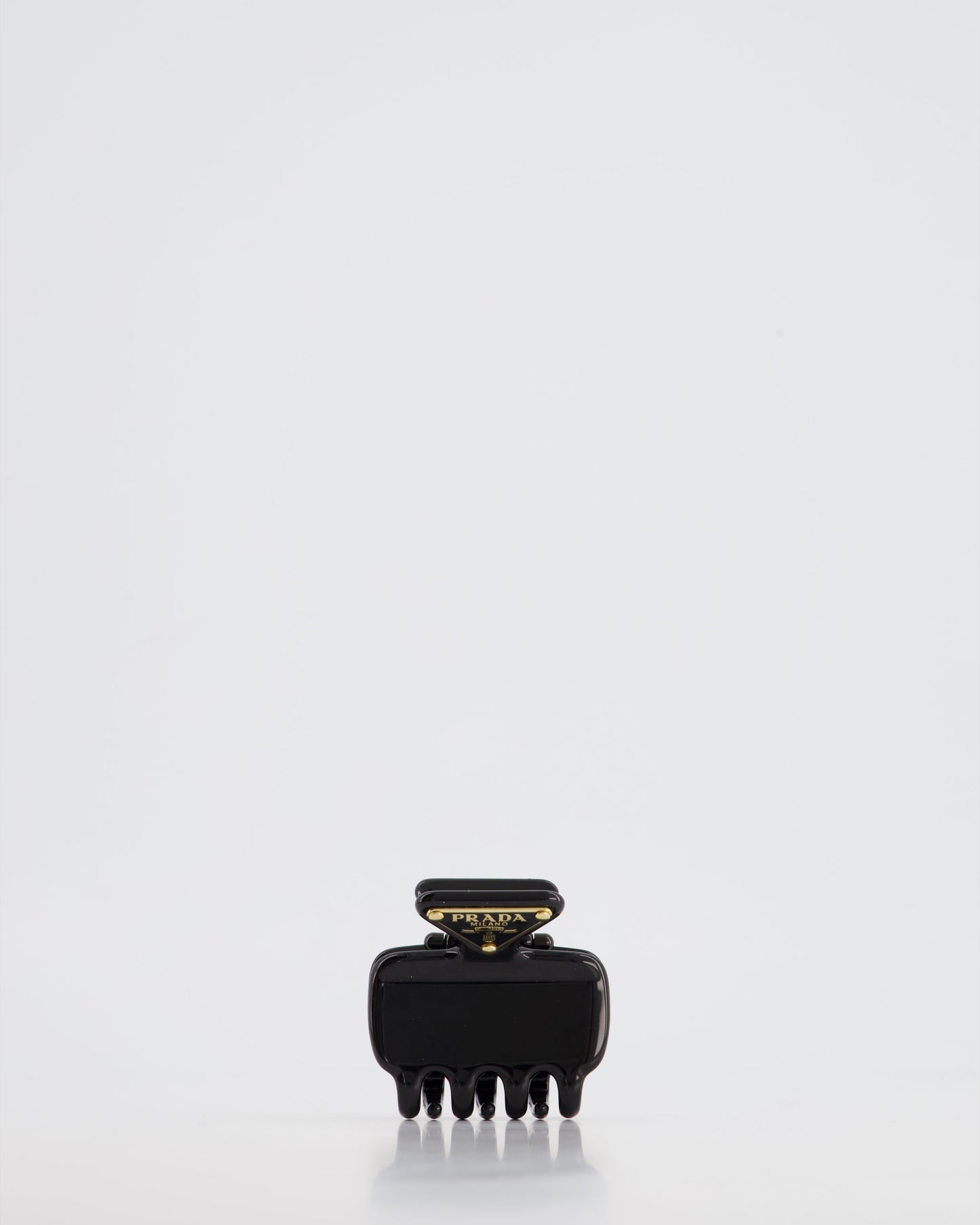 Prada Black Enameled Metal Claw Hair Clip with Gold Triangle Logo Plaque