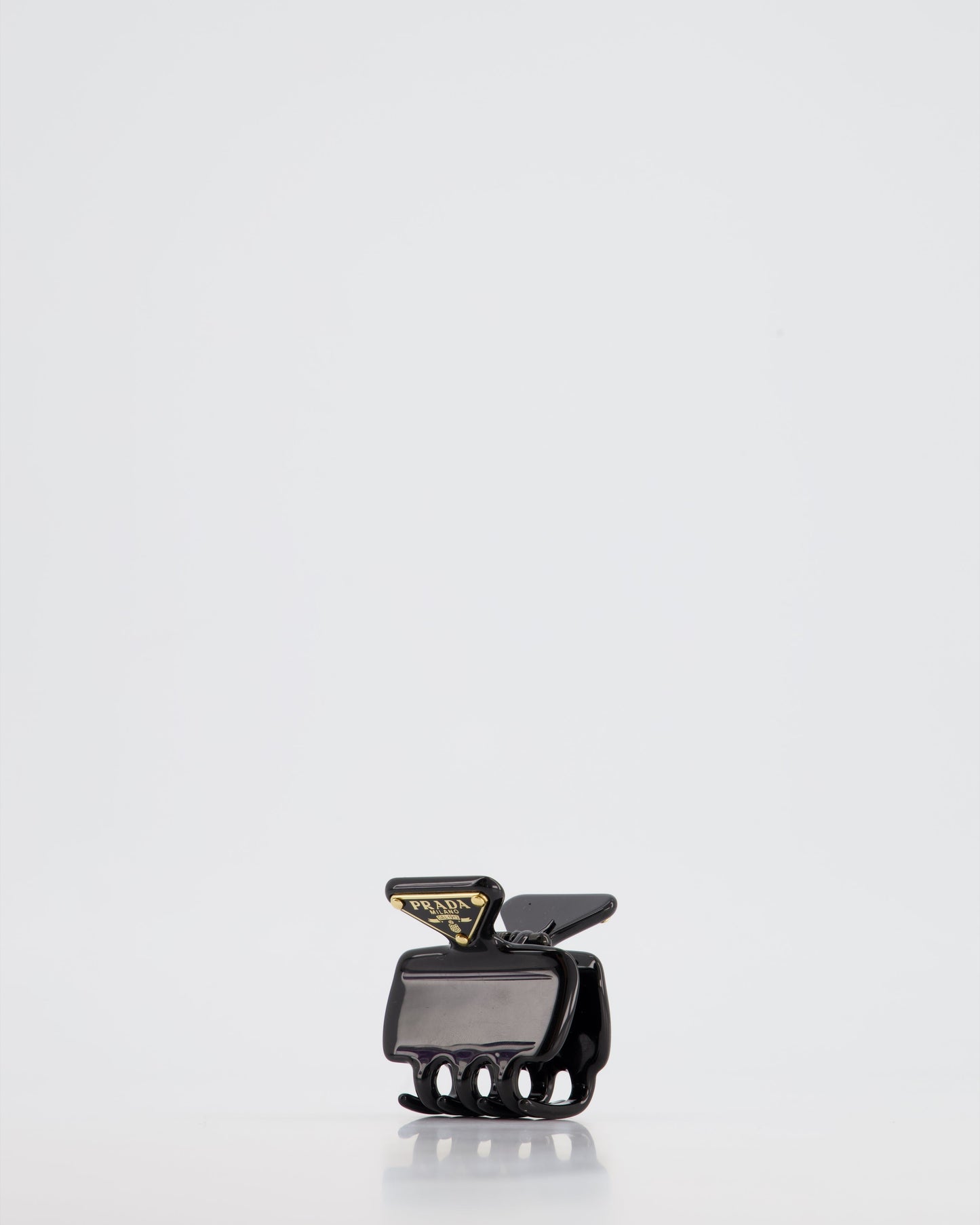 Prada Black Enameled Metal Claw Hair Clip with Gold Triangle Logo Plaque
