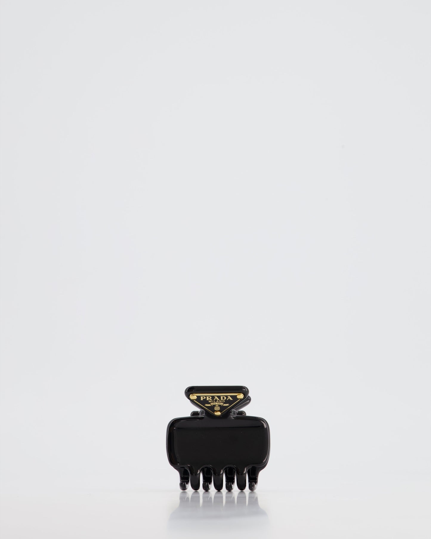 Prada Black Enameled Metal Claw Hair Clip with Gold Triangle Logo Plaque