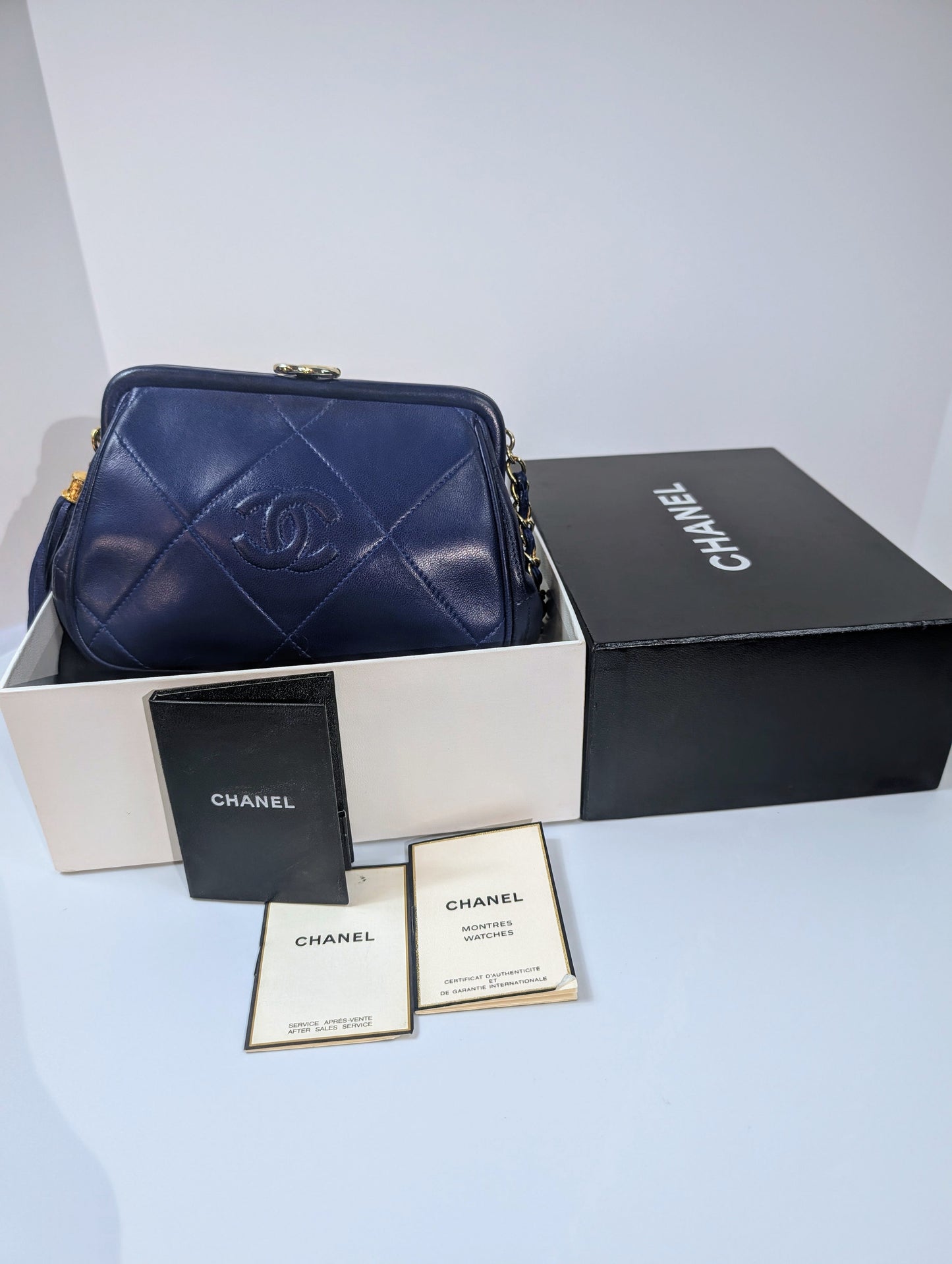 Chanel   Blue Quilted Lambskin Kisslock Tassel Clutch with Strap