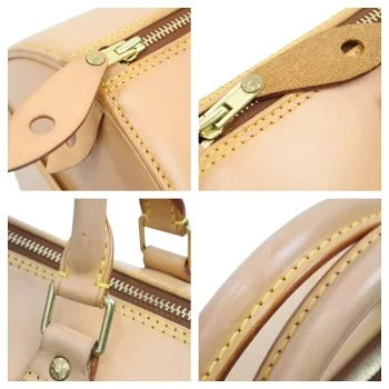 Louis Vuitton Speedy Nomad Handbag
