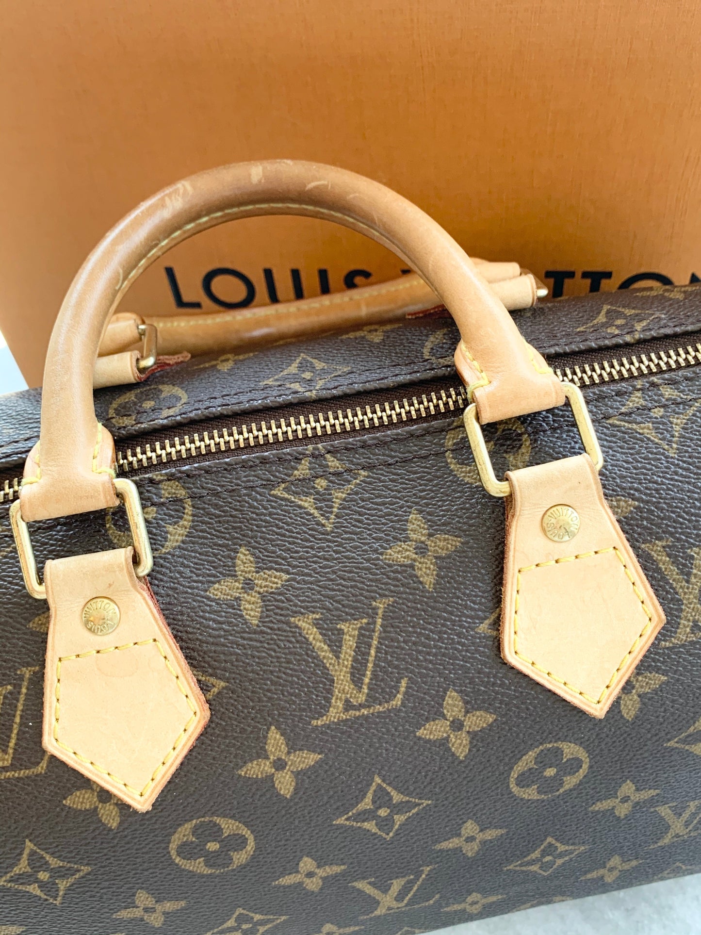 [ ] Louis Vuitton Speedy 25 Monogram Satchel Bag