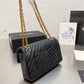 Black Chanel woman handbag