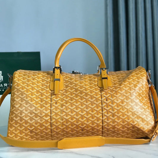 BOSTON 50 BAG IN YELLOW GOYARDINE CANVAS AND CALFSKIN TRIM by Amelia