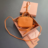 MICRO BAG KEYCHAIN 11 IN HOT CINNAMON ORANGE CALFSKIN EMBOSSED LOGO Amelia