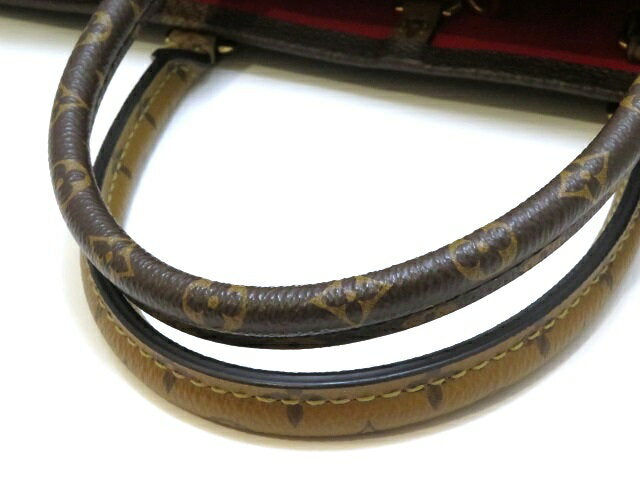 Louis Vuitton On The Go GM Monogram Giant Reverse Handbag
